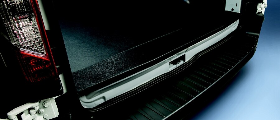 Shot of heavy-duty scuff plates on the rear of a 2023 Ford Transit® van