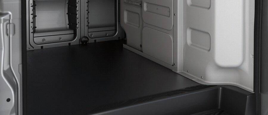 Shot of heavy-duty flooring covering the cargo area of a 2023 Ford Transit® van