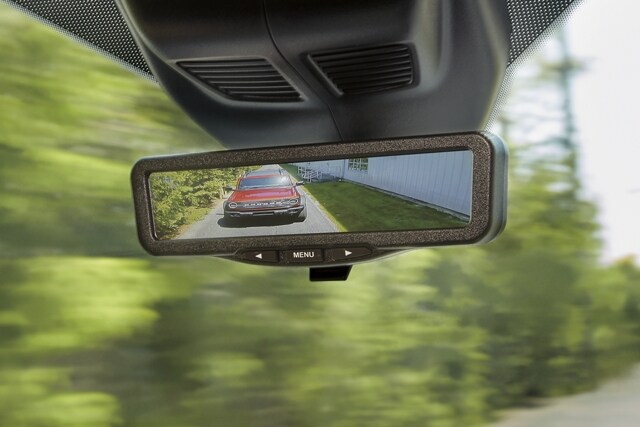 Image of vehicle on road in virtual rear view mirror in 2023 Ford Transit®
