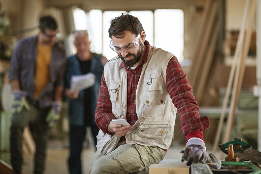 A person looking at the FordPass App on their smartphone