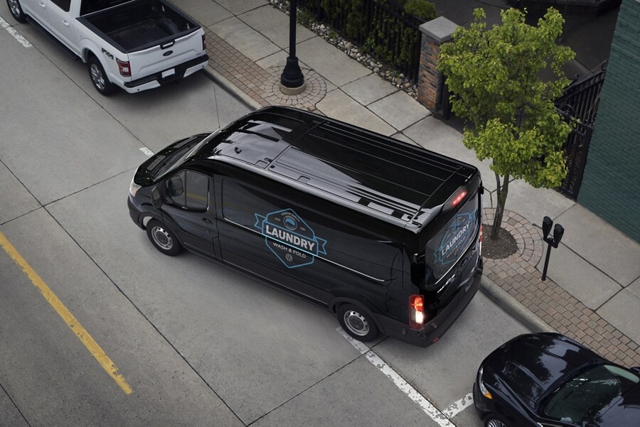 A 2024 Ford Transit® van being parallel parked