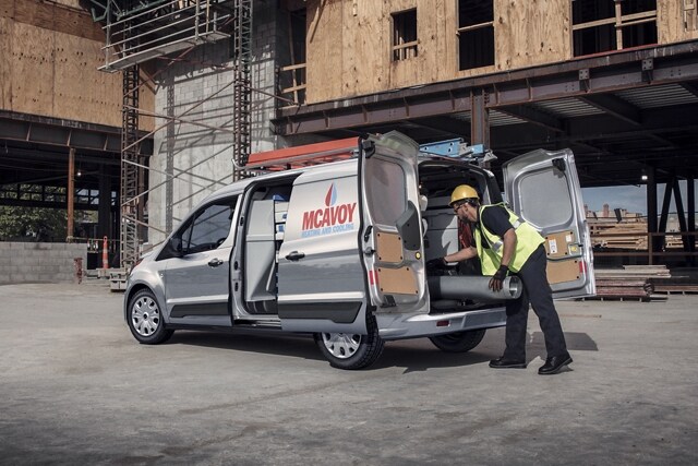2023 Ford Transit Connect Cargo Van In Silver with doors open on job site