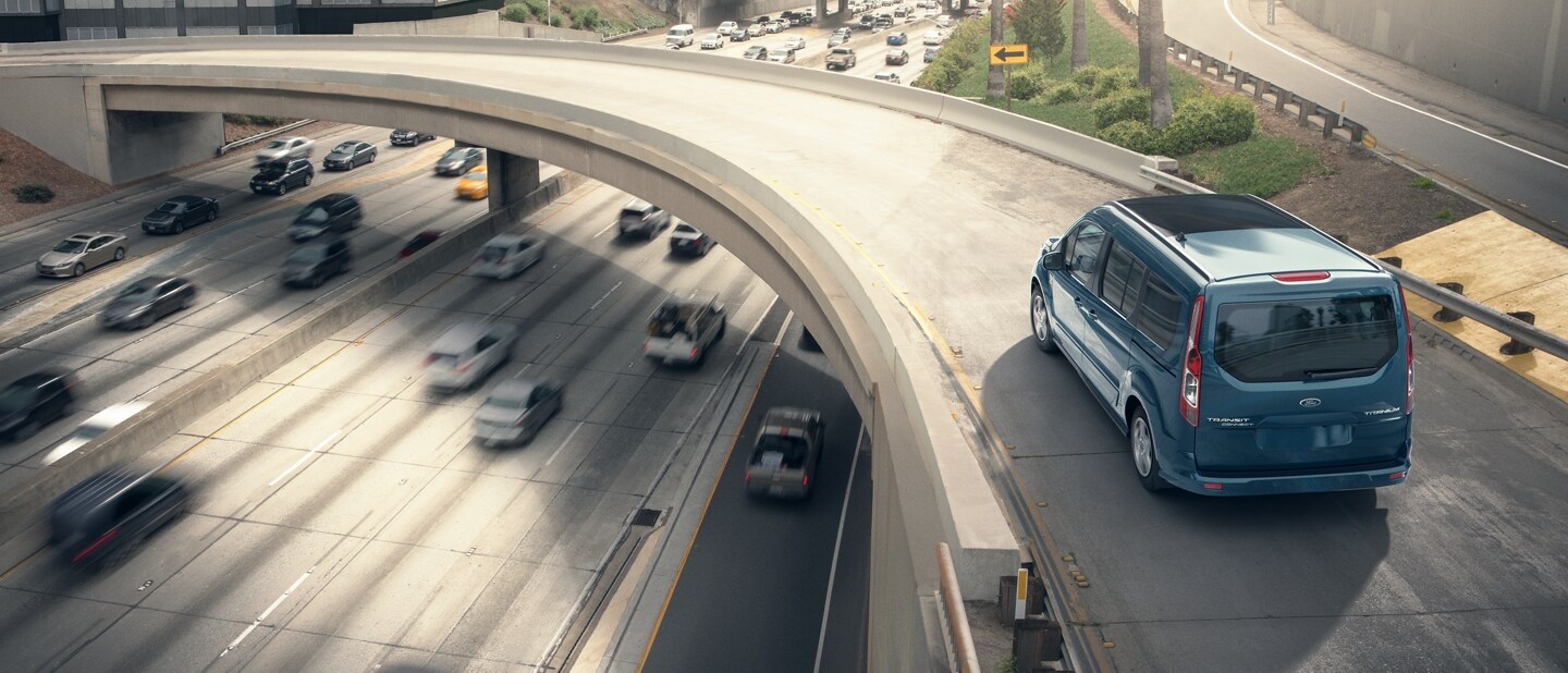 2023 Ford Transit driving on a bridge